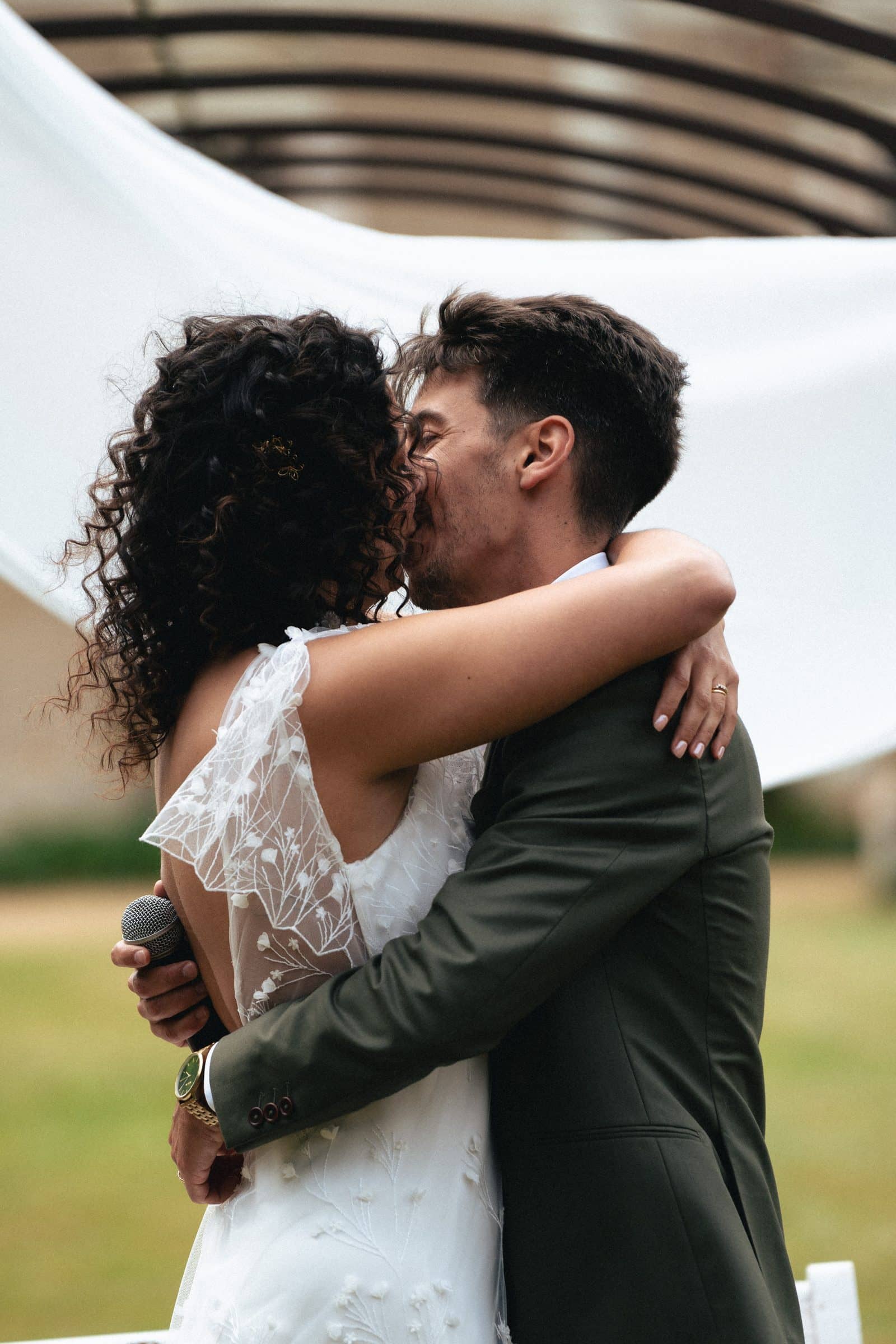 Newlyweds hugging and laughing