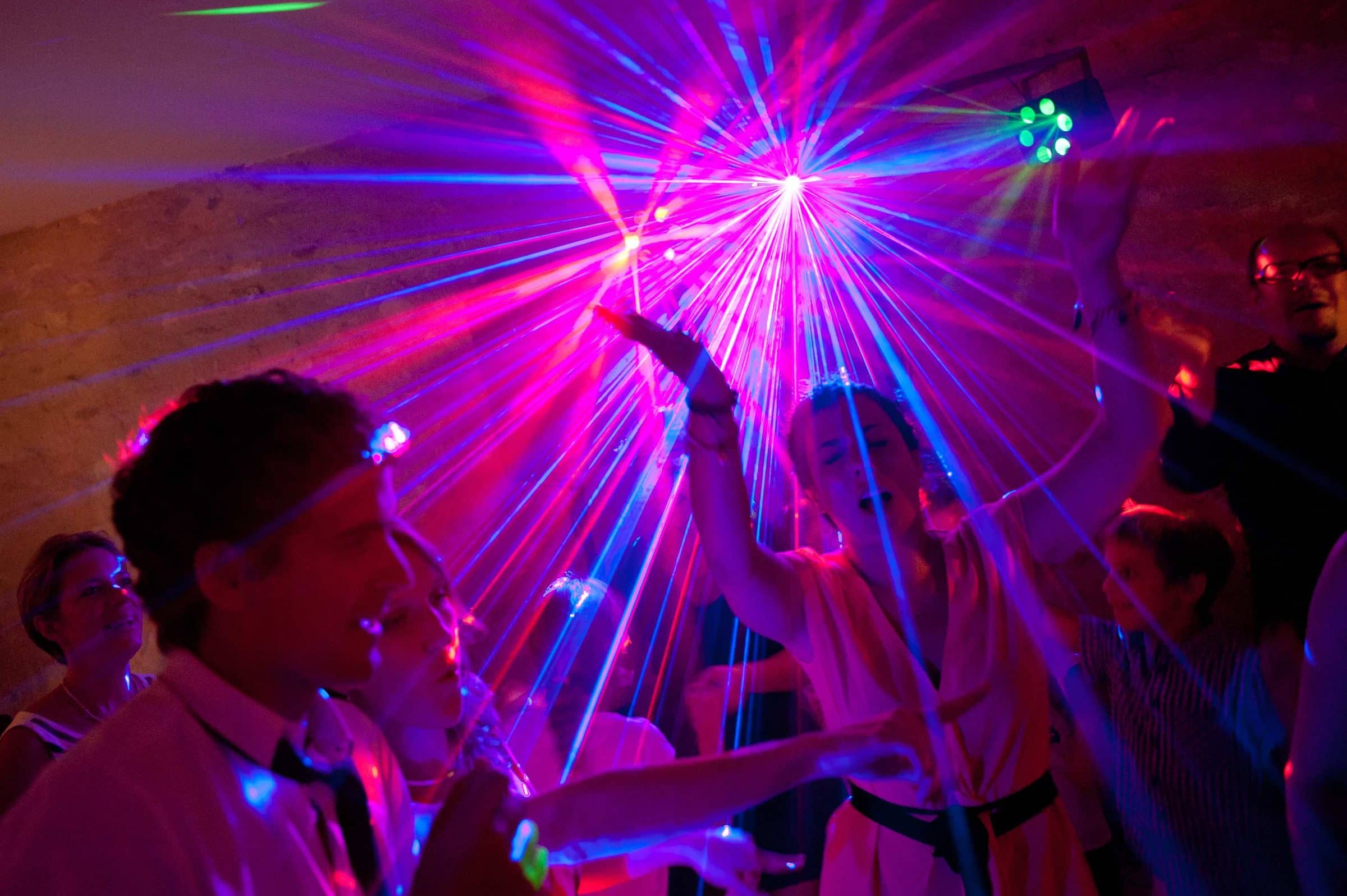 Dance floor criss-crossed by light beams