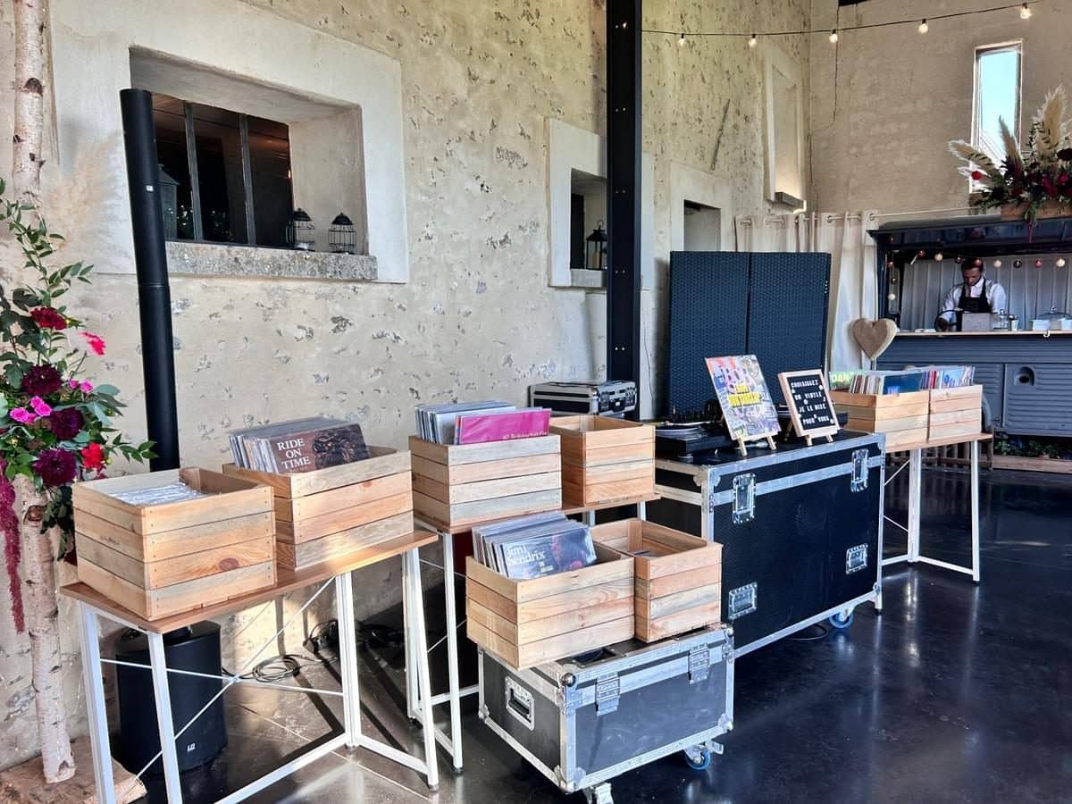 Vinyl bar set up in a reception room, record crates and turntables
