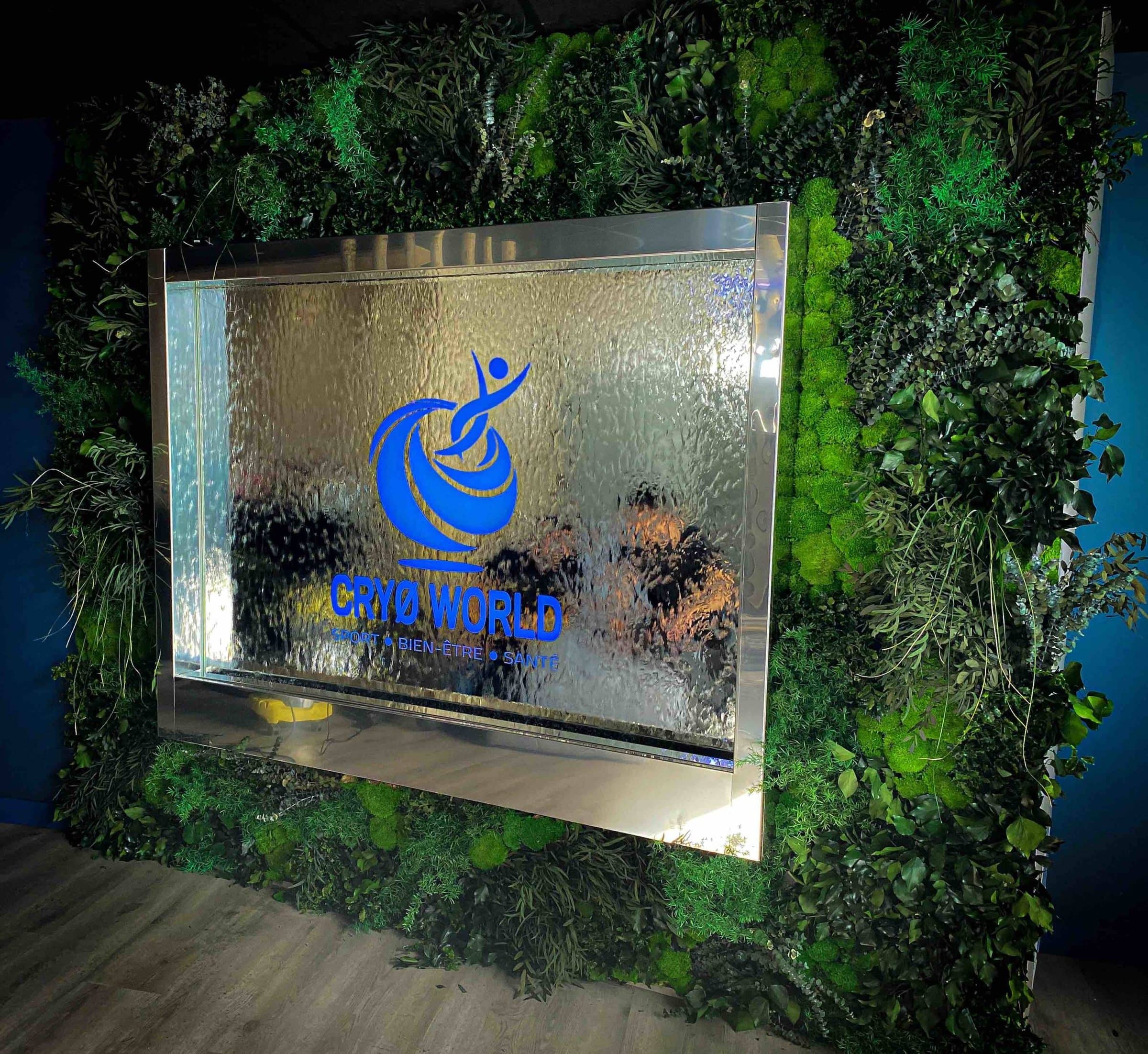 Water wall personalised with a logo, set in a green wall