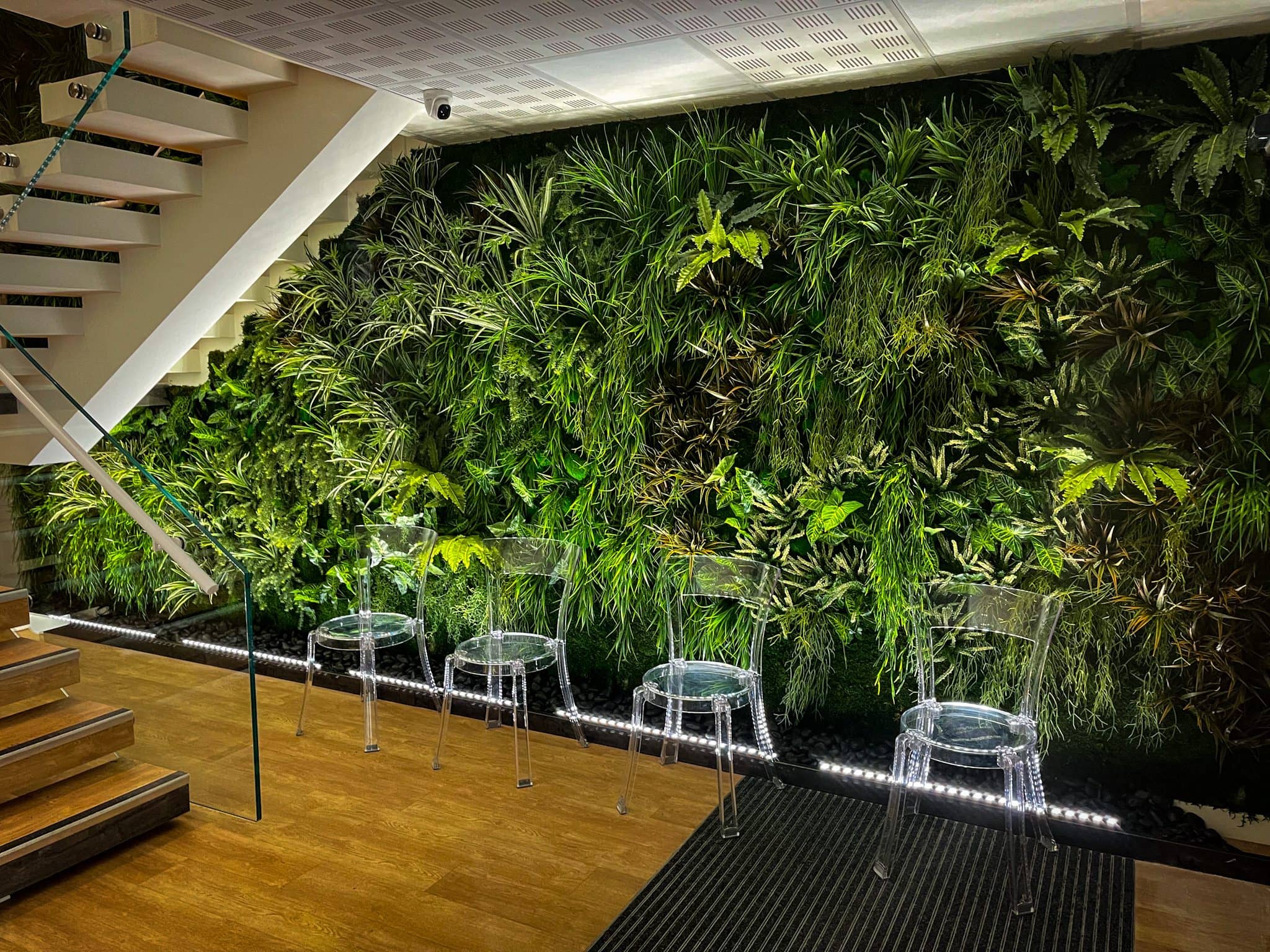 Illuminated green wall in an entrance hall