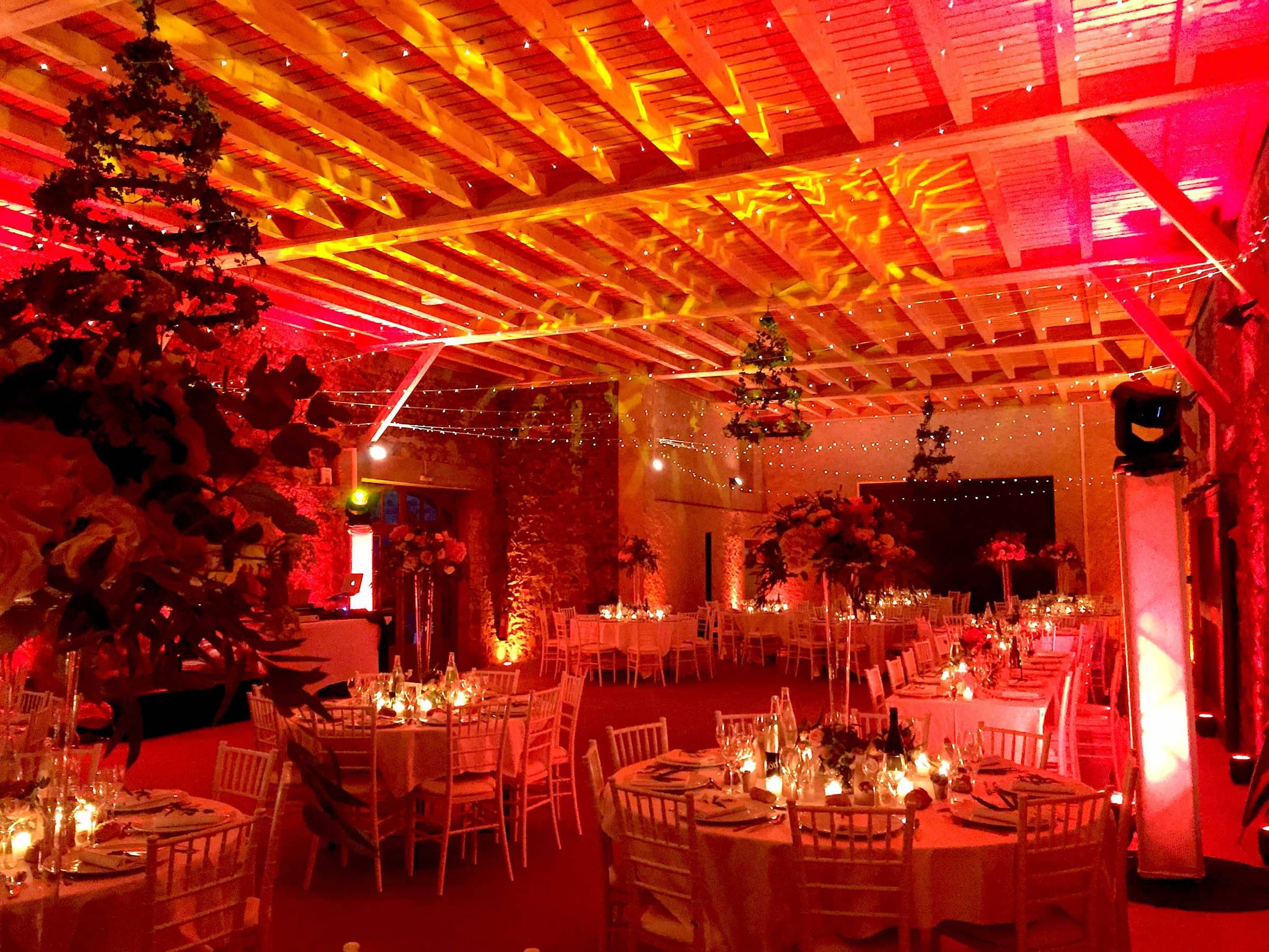 Reception room lit in red and amber for dinner